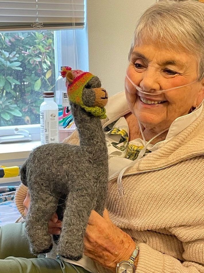 Mom with the alpaca she named after her son
